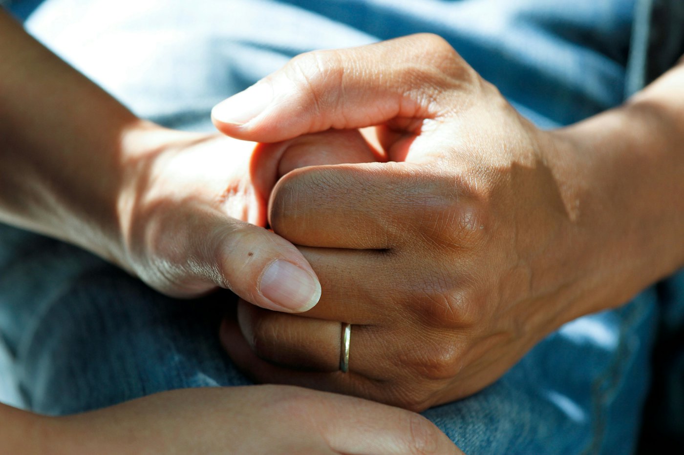 One person holding another's hand