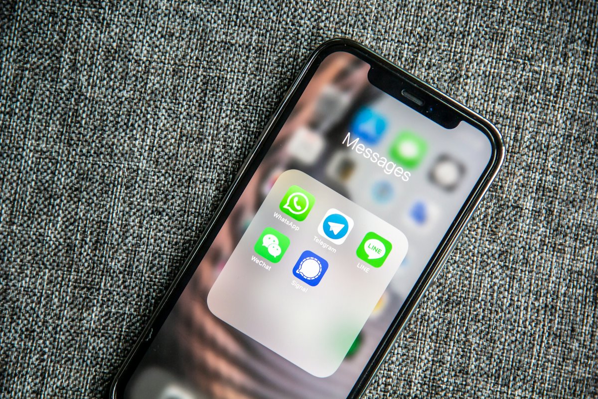 A phone showing WhatsApp, Telegram and other messaging apps