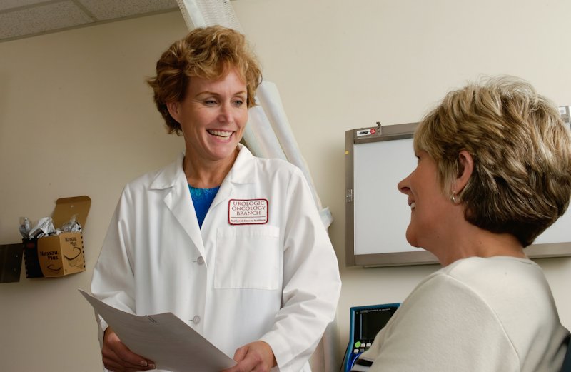 A doctor going through a written plan with a patient